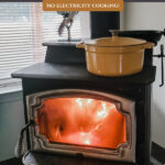 Pinterest pin for how to cook on a woodstove. Image of a pot of food on a woodstove.