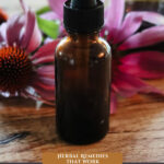 Pinterest pin for COVID herbal remedies. Image of flowers and herbs.