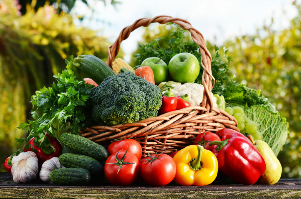 Healthy vegetables in a basket on a table.