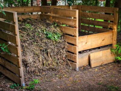 Wooden two-sided compost bin.