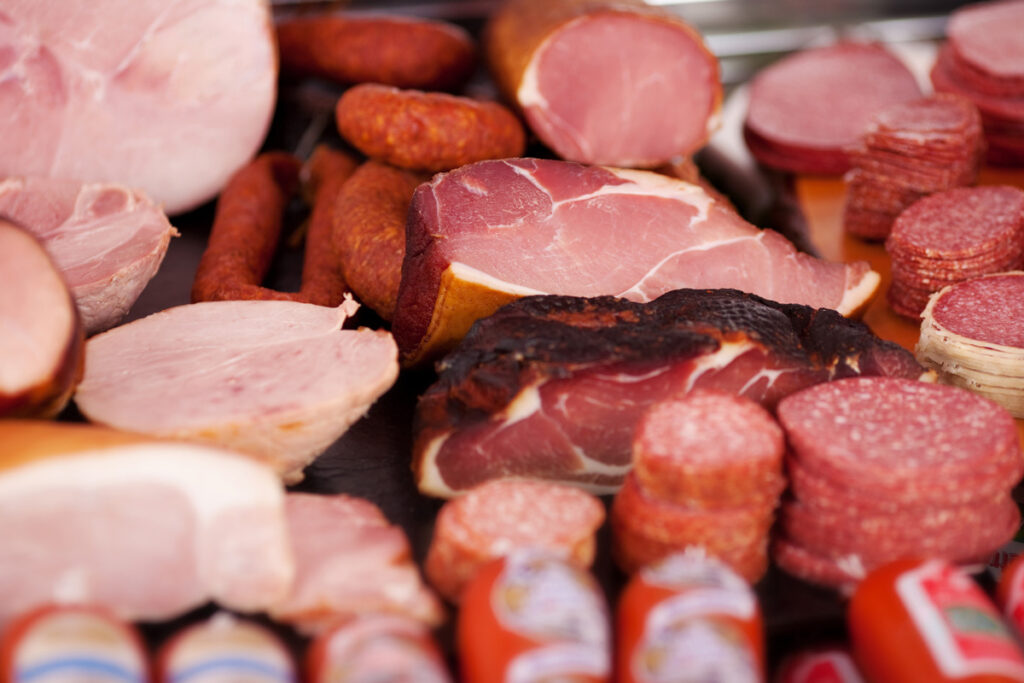 Various cured meats on a table.