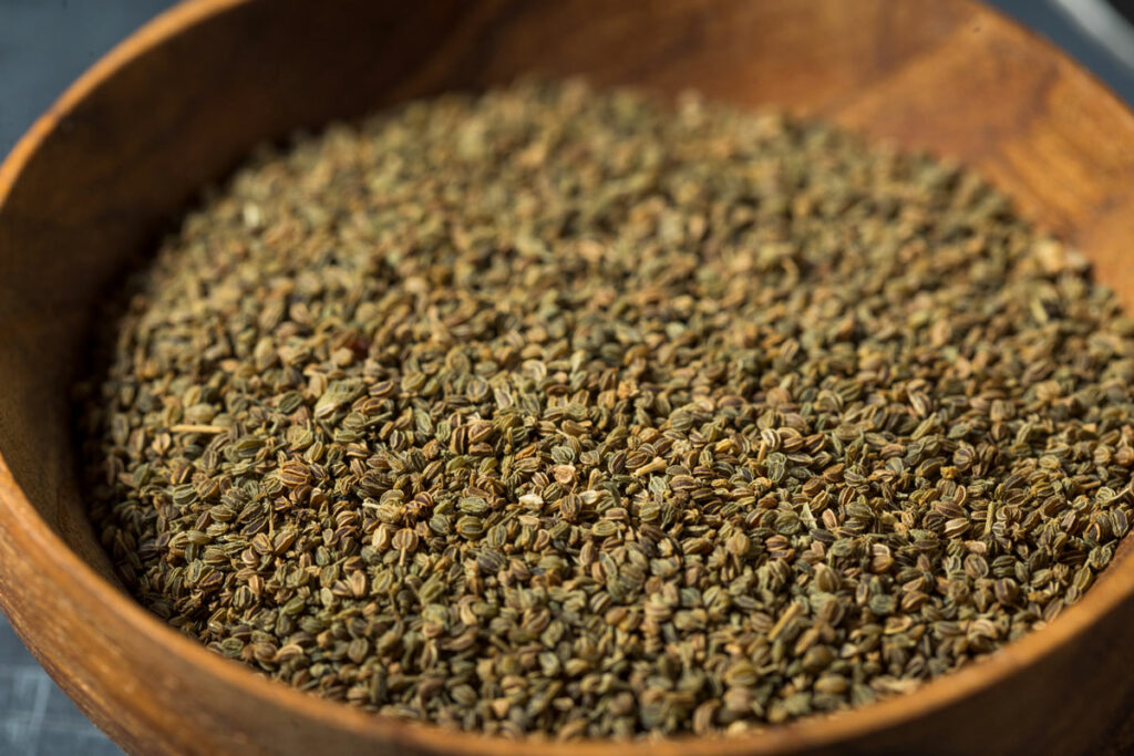 Celery seed in a wooden bowl.