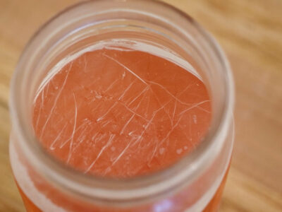 Kahm yeast on the surface of a ferment in a mason jar.