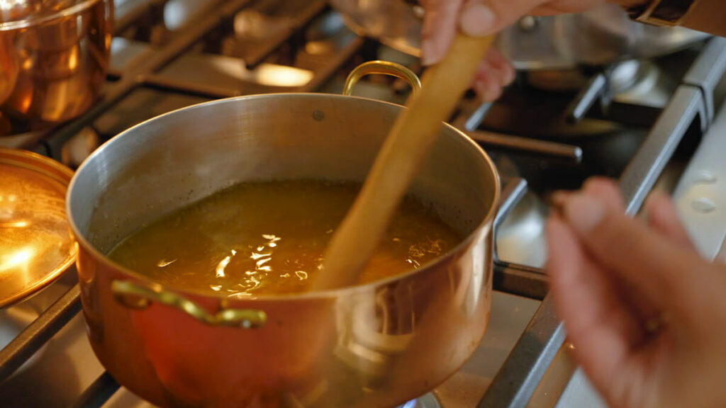 Stirring the brine for bread and butter pickles.