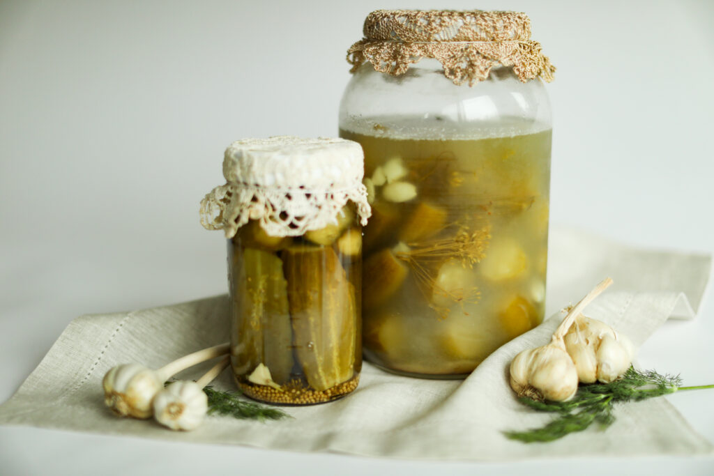 Fermented pickles in large jars.