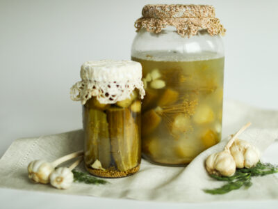 Fermented pickles in large jars.