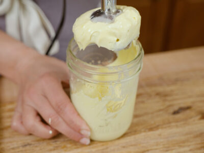 Homemade mayonnaise in a jar.