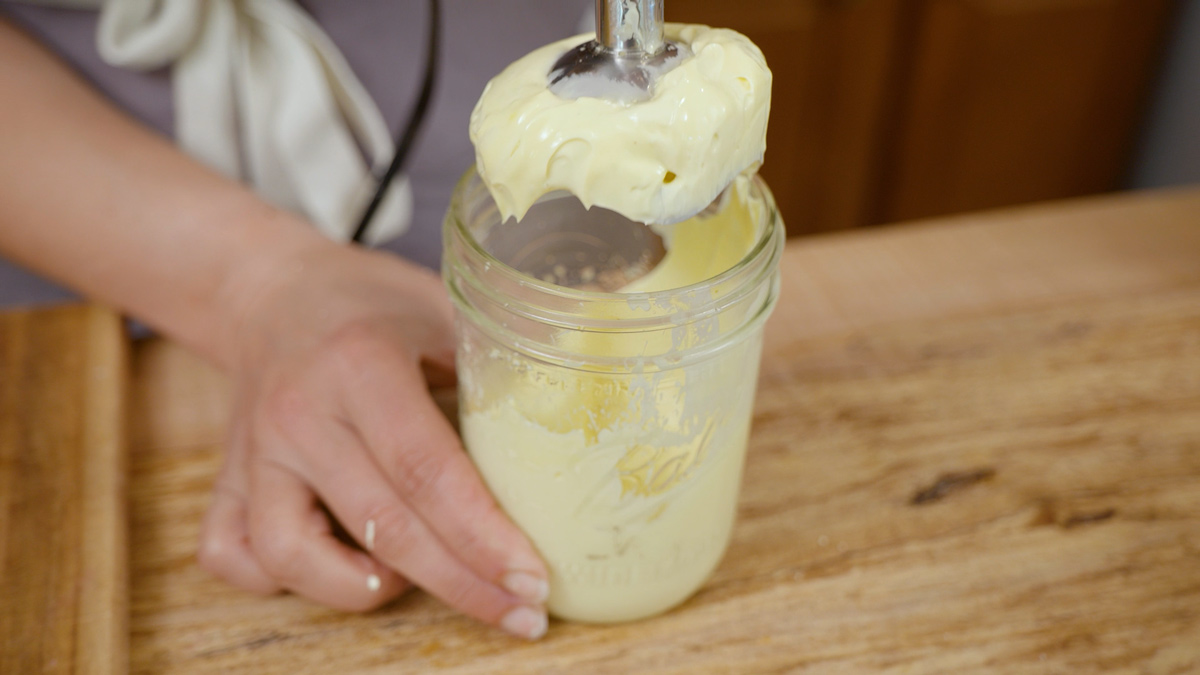 Homemade mayonnaise in a jar.