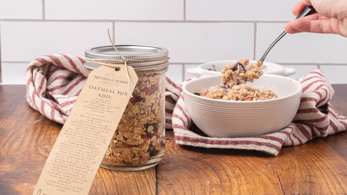 A jar of instant oatmeal mix sitting next to a bowl of prepared oatmeal.