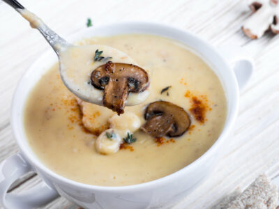 Cream of mushroom soup in a white bowl.