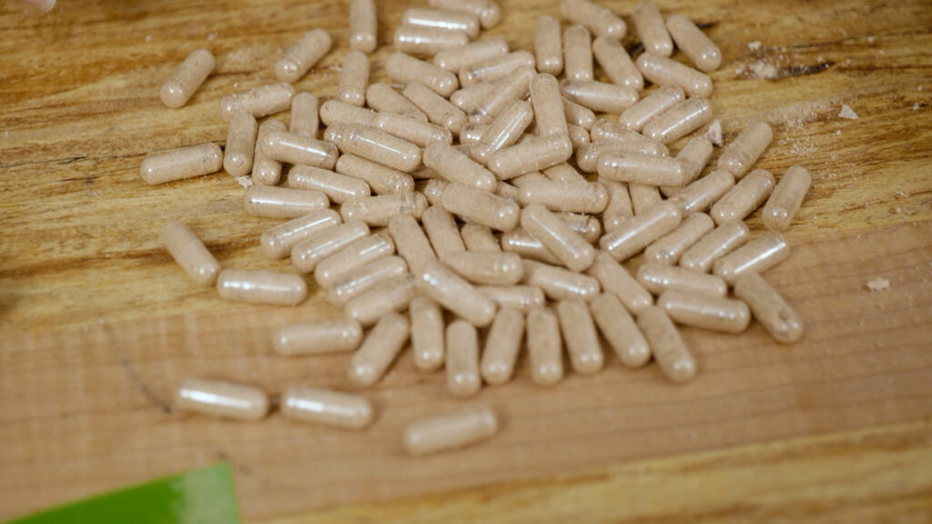 Beef liver supplements on a wooden counter.