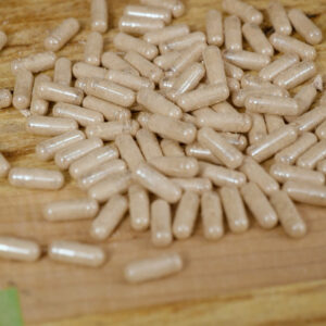 Beef liver supplements on a wooden counter.