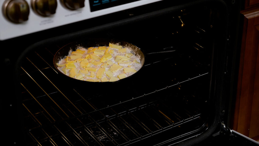 A dump cake in the oven to be baked.