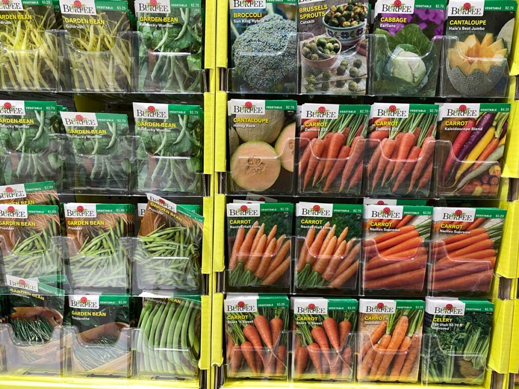 Garden seeds on a display rack in a store.