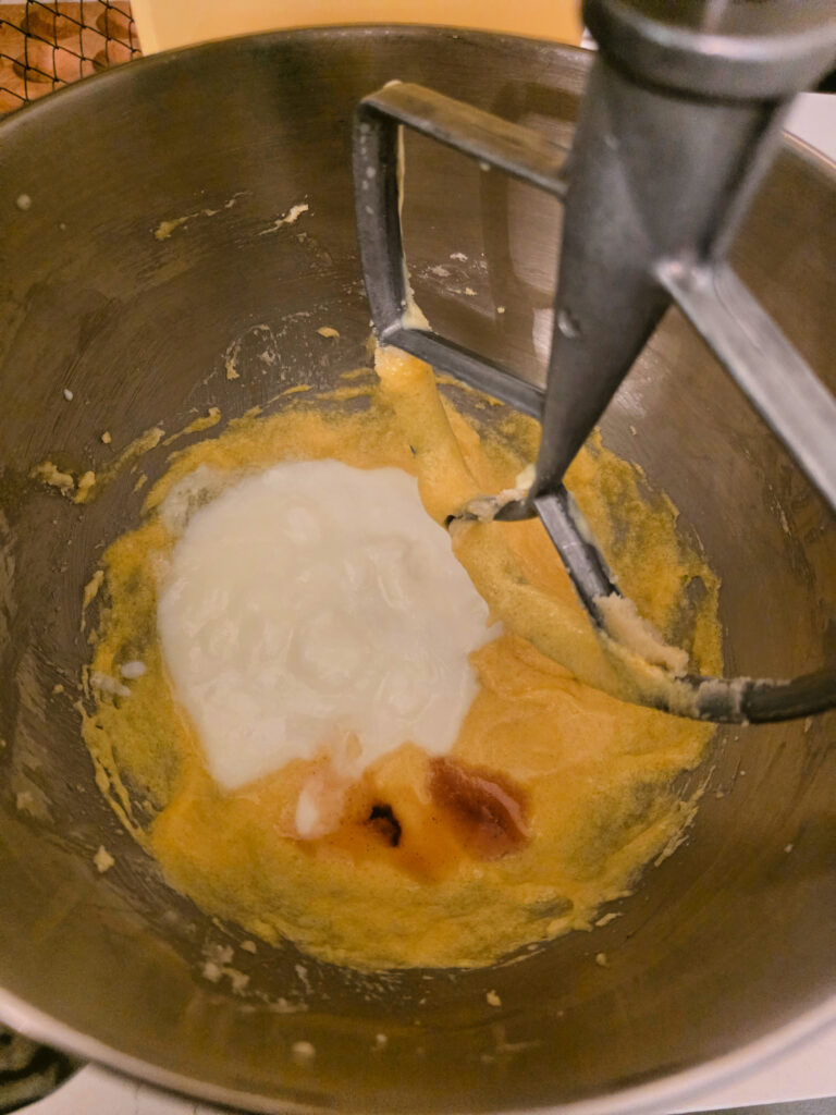 yogurt and vanilla to wet strawberry short cake ingredients in a stand mixing bowl