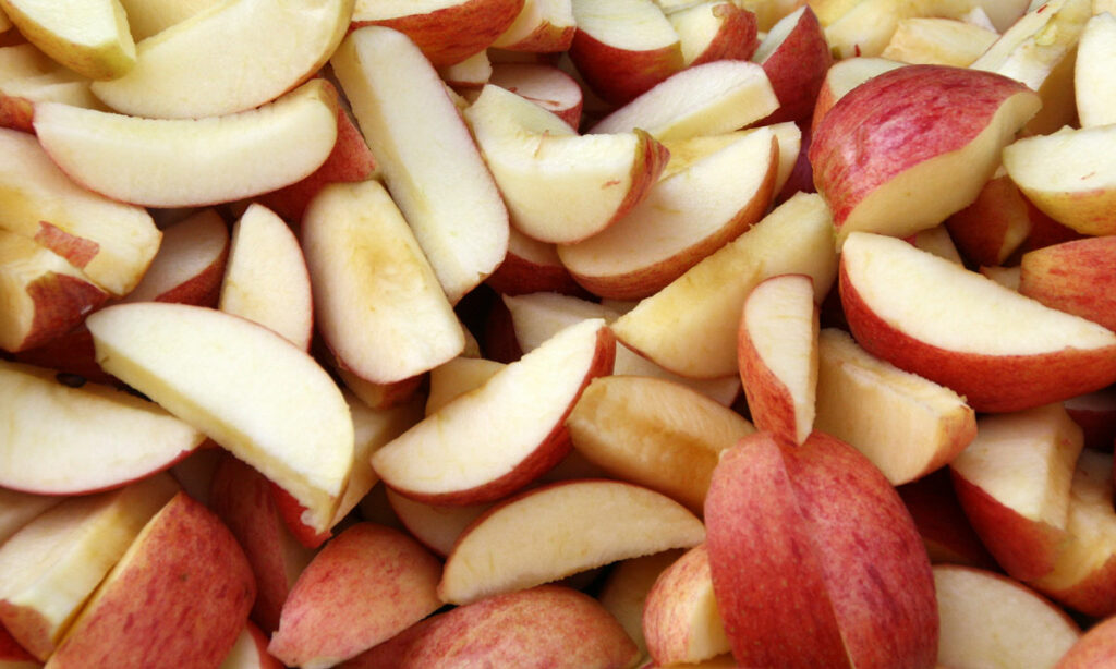 Sliced apples in a pile.