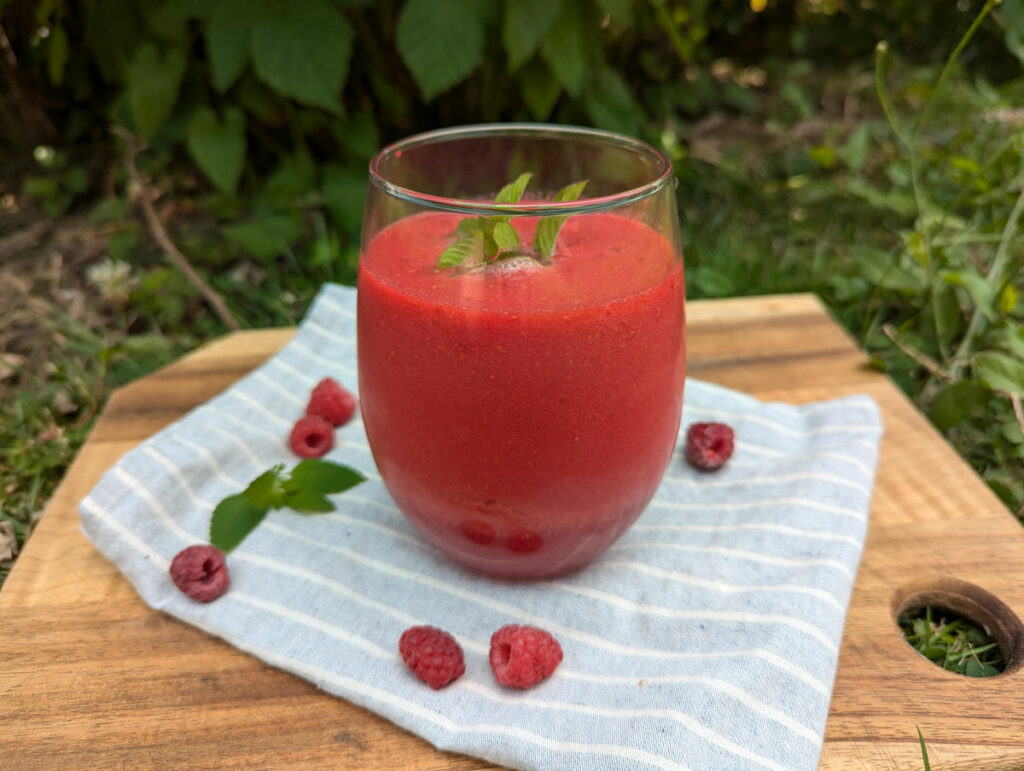 Fresh raspberry juice in a glass.