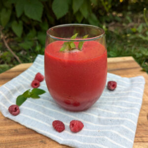 Fresh raspberry juice in a glass.