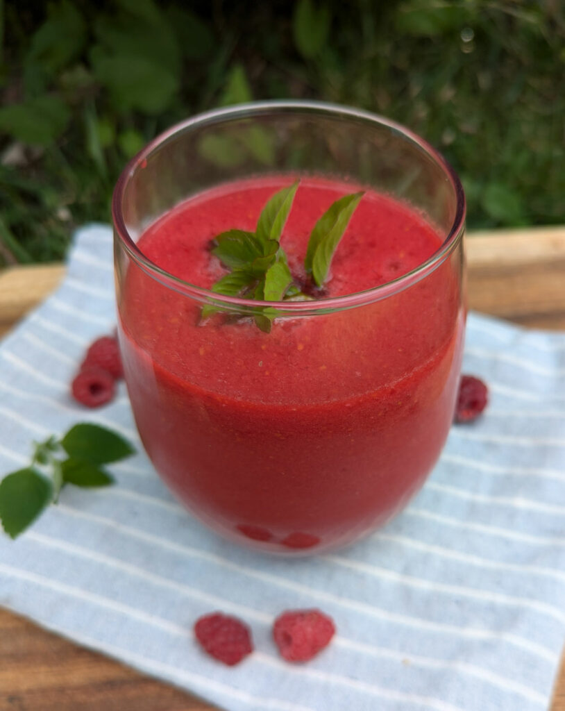 Fresh raspberry juice in a glass.