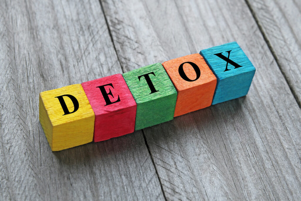 Wooden blocks that spell out detox.