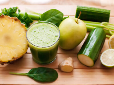 Green juice with pineapple, apple, cucumber, ginger and other veggies.