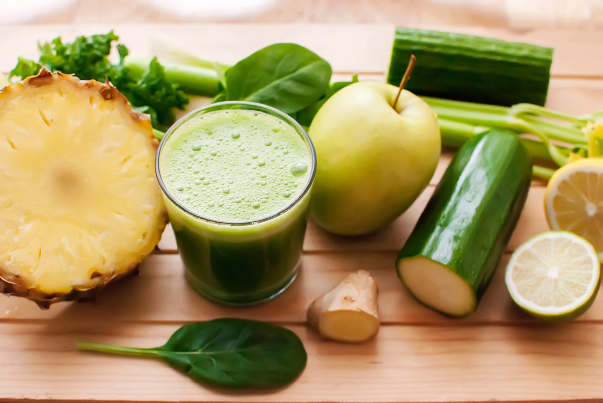 Green juice with pineapple, apple, cucumber, ginger and other veggies.