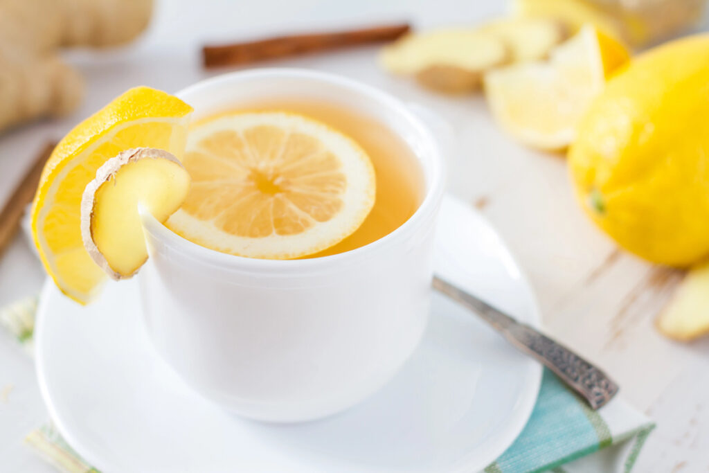 Lemon water in a white tea cup.