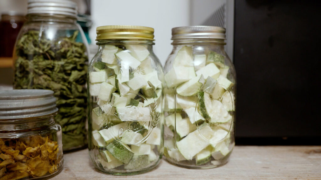 Two jars of cubed freeze dried zucchini.