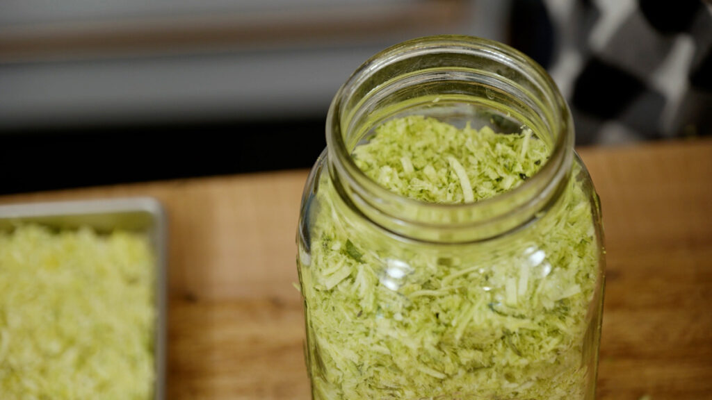 A close up jar of freeze dried zucchini.