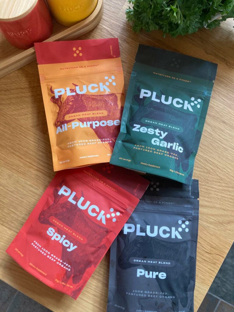 Four colorful bags of Pluck Seasoning.