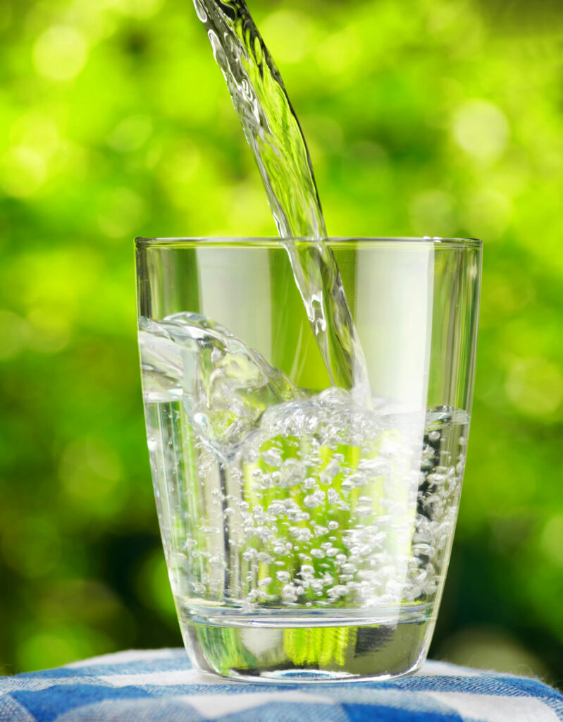 Water being poured into a glass.