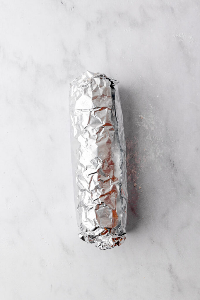 A pumpkin roll wrapped in tinfoil.