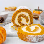Pumpkin roll sliced on the counter.