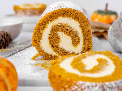 Pumpkin roll sliced on the counter.