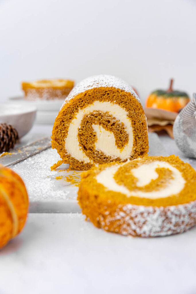 Pumpkin roll sliced on the counter.