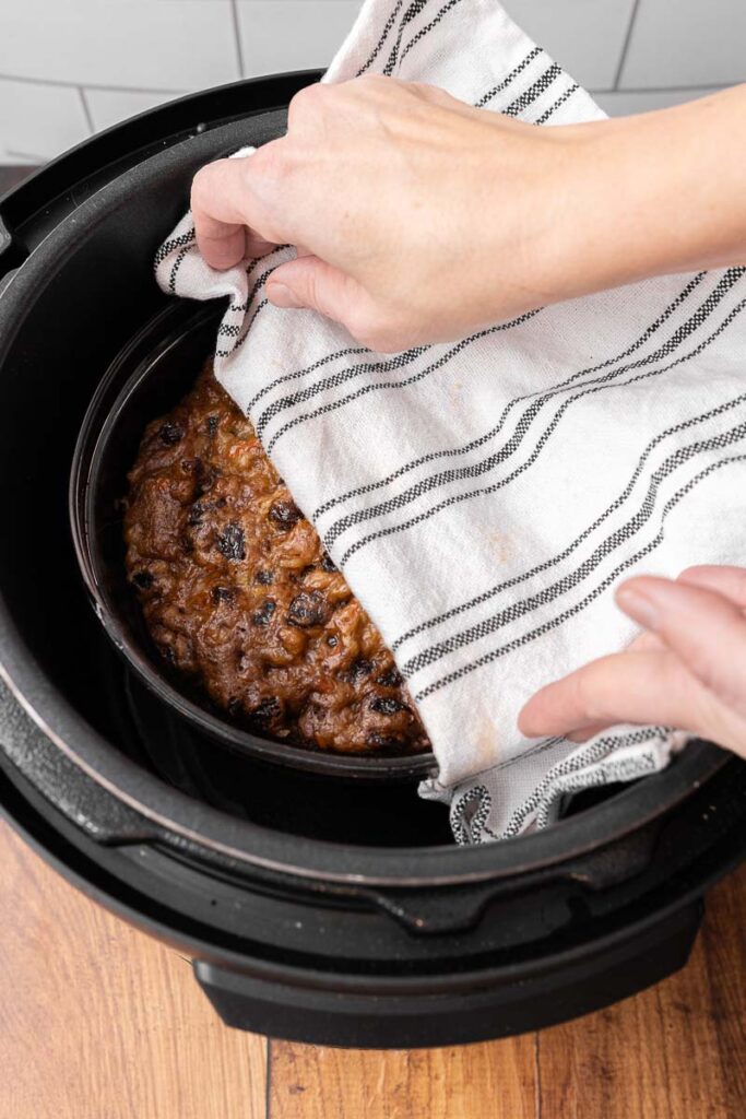 Removing a Christmas pudding from the instant pot.