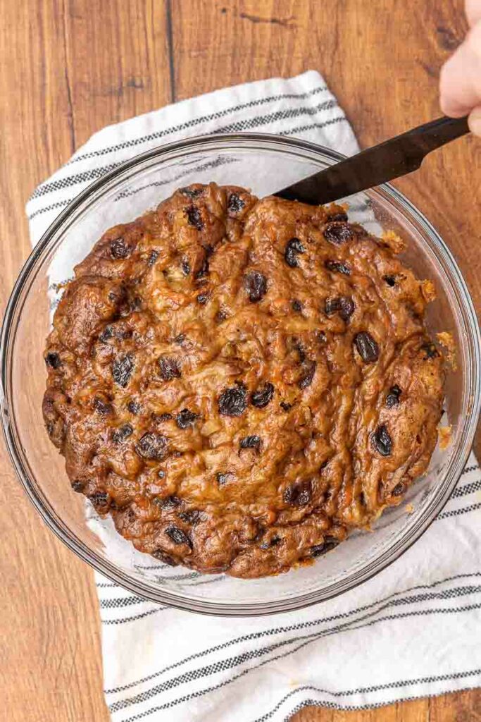 Christmas pudding in a clear white bowl.