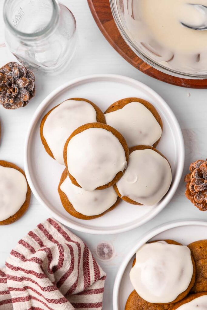 Ginger cream cookies on a plate with holiday decor on the table.