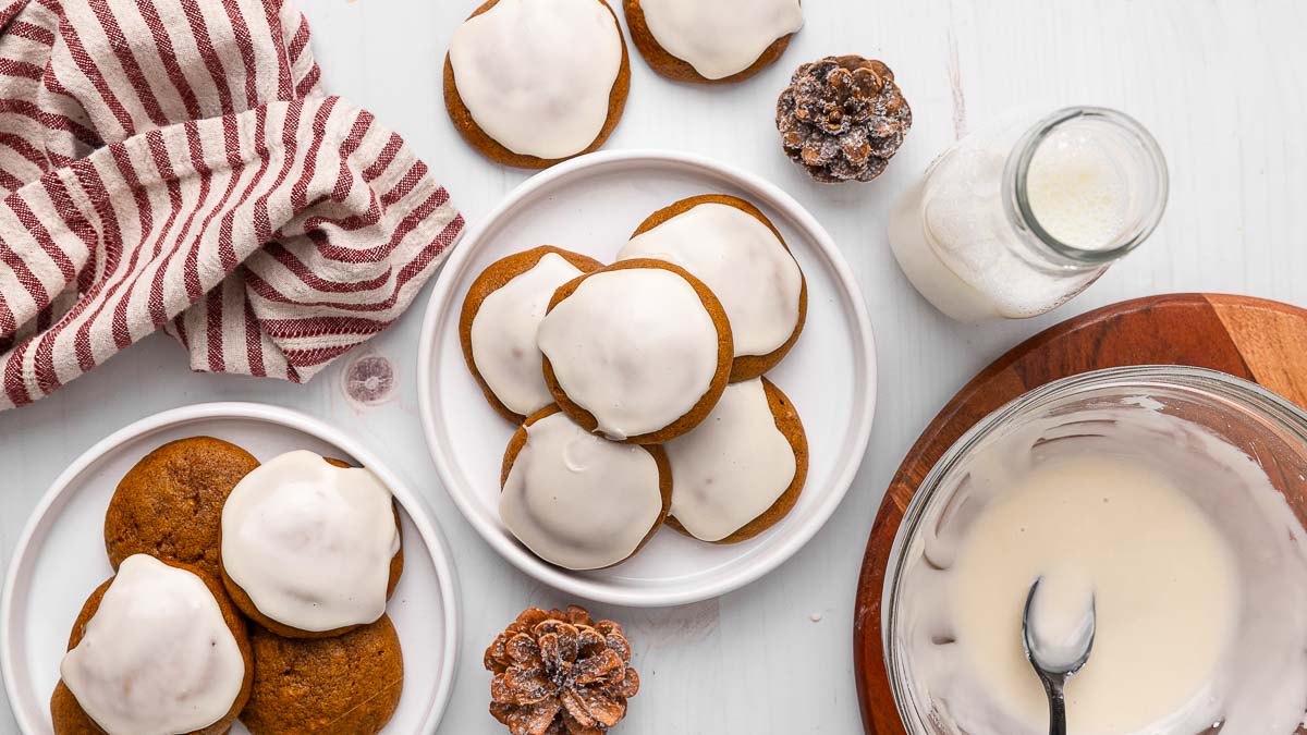 Ginger cream cookies on a plate with holiday decor on the table.