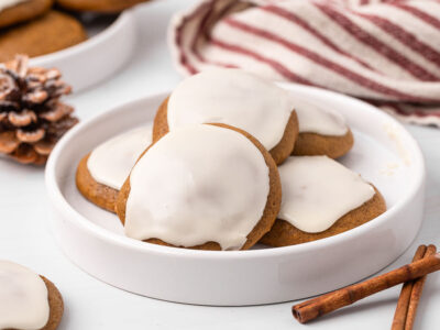 Ginger cream cookies on a plate with holiday decor on the table.