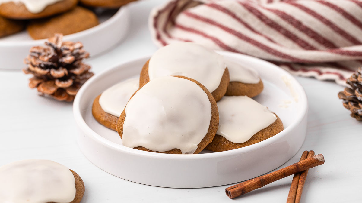 Ginger cream cookies on a plate with holiday decor on the table.