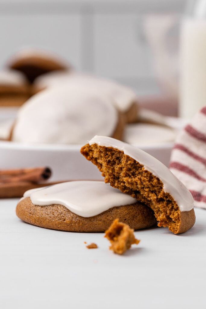 Ginger cream cookie broken in half.