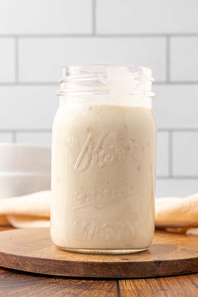 A Mason jar with cream of chicken soup in it.