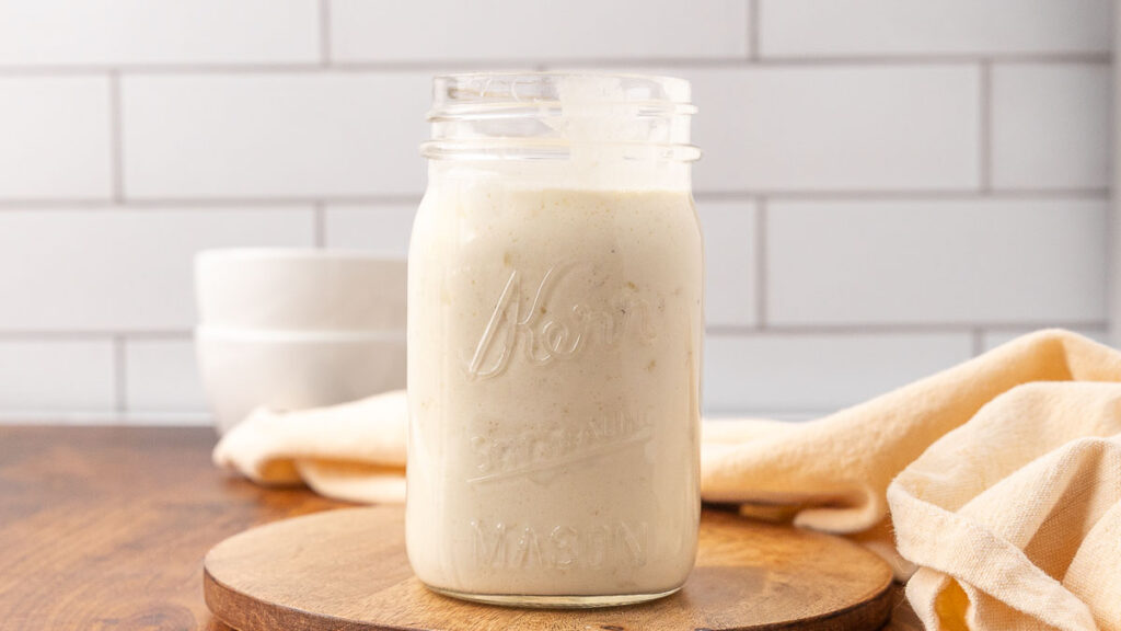 A Mason jar with cream of chicken soup in it.