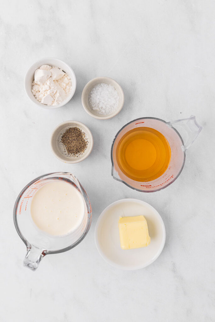 Ingredients for cream of chicken soup in bowls.