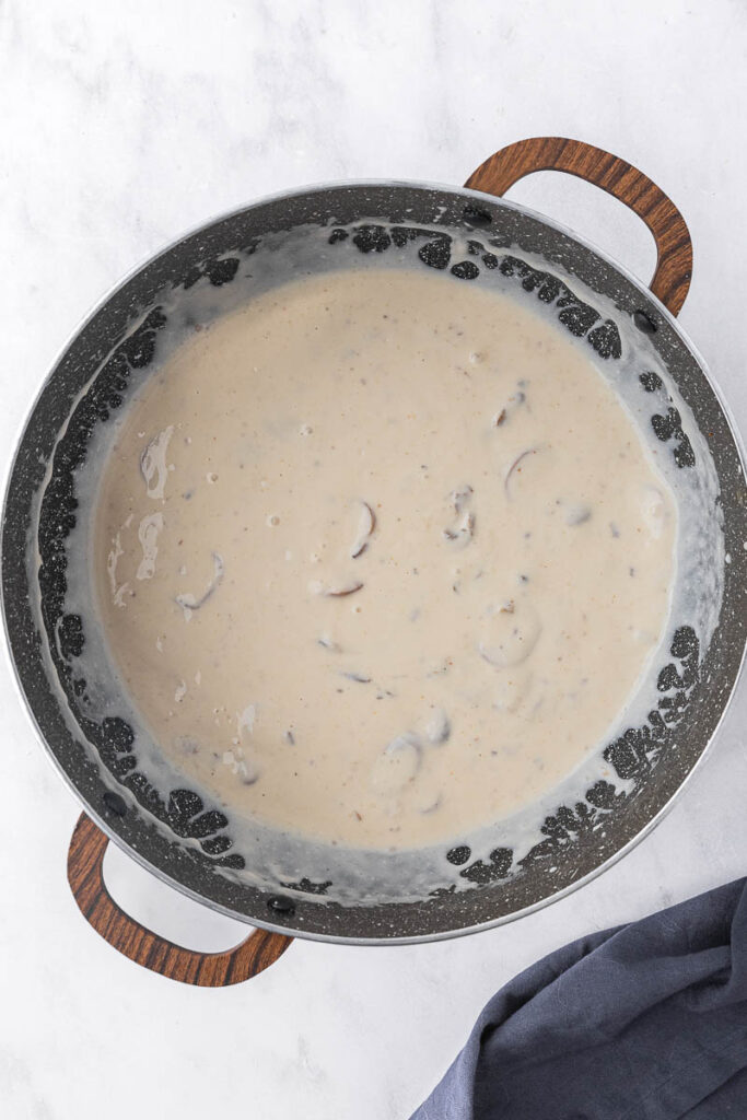 Cream of mushroom soup in a pan.