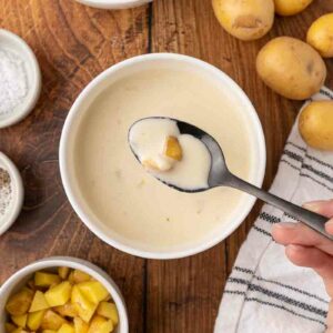 Cream of potato soup with a spoonful.