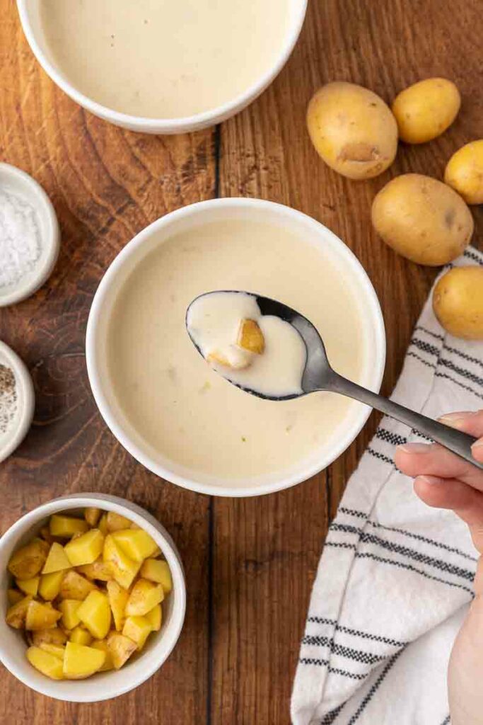 Cream of potato soup with a spoonful.