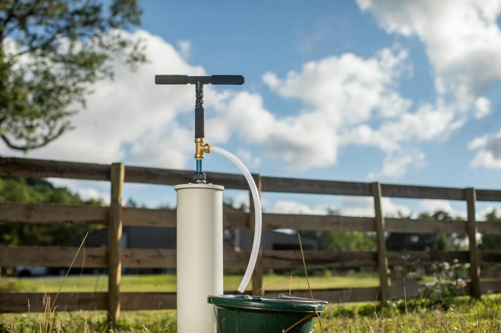 A hand pump water pump for a well.