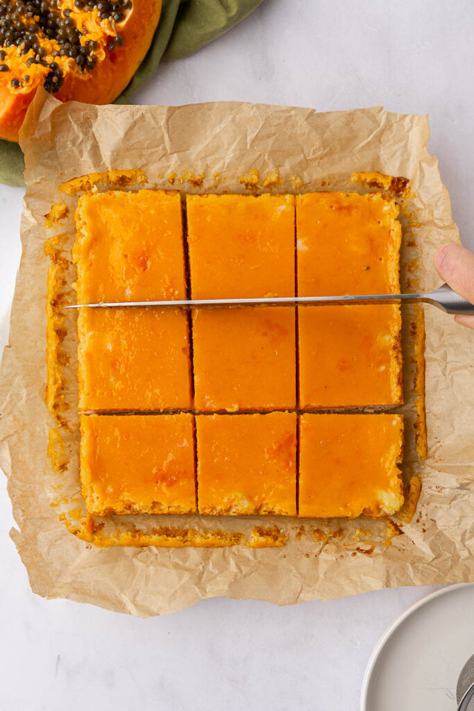 Baked papaya bars sliced into squares.